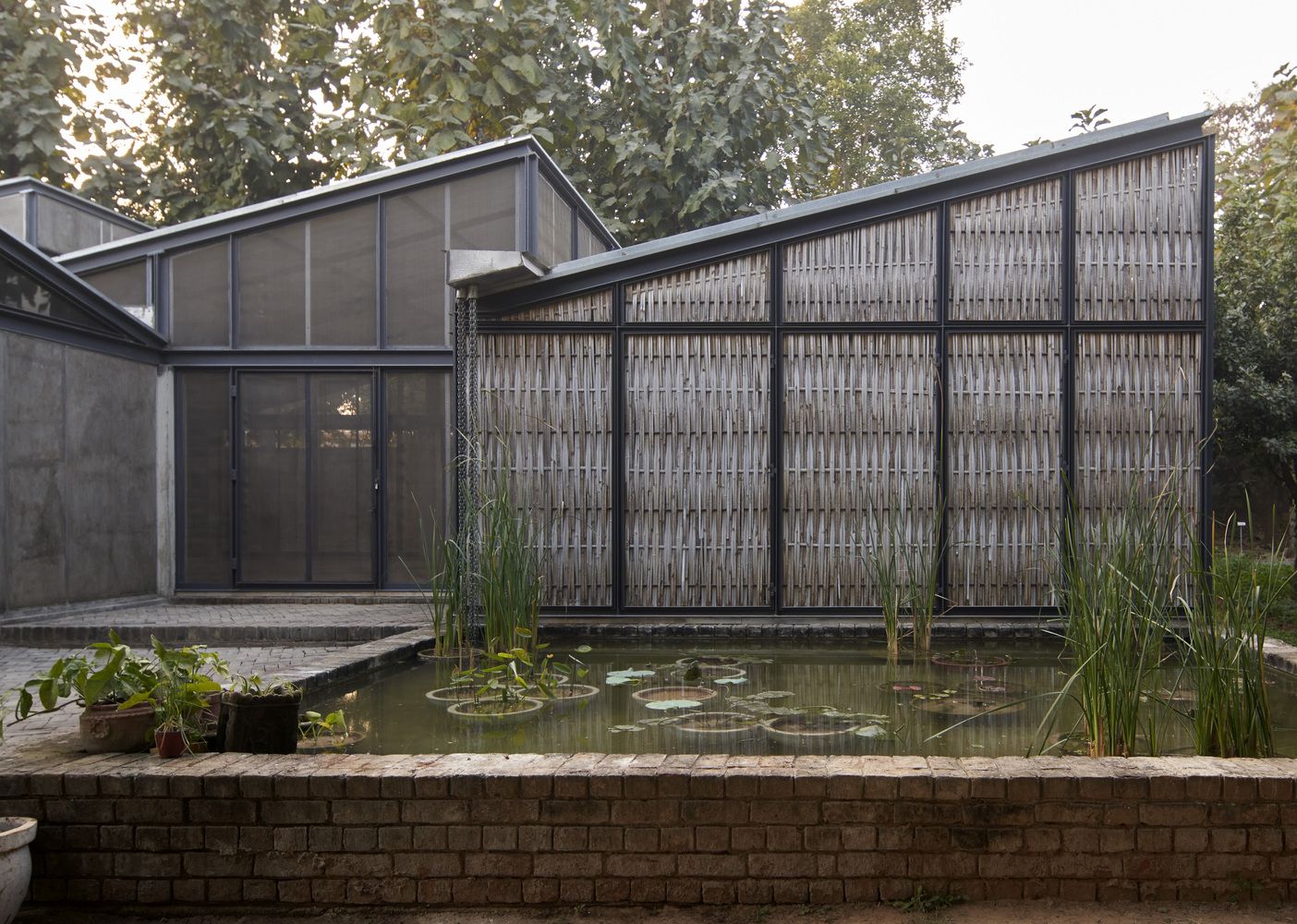 The pond and the studio — studios by Studio Array, photograph © Edmund Sumner